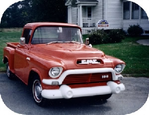 Classic GMC truck in front of store